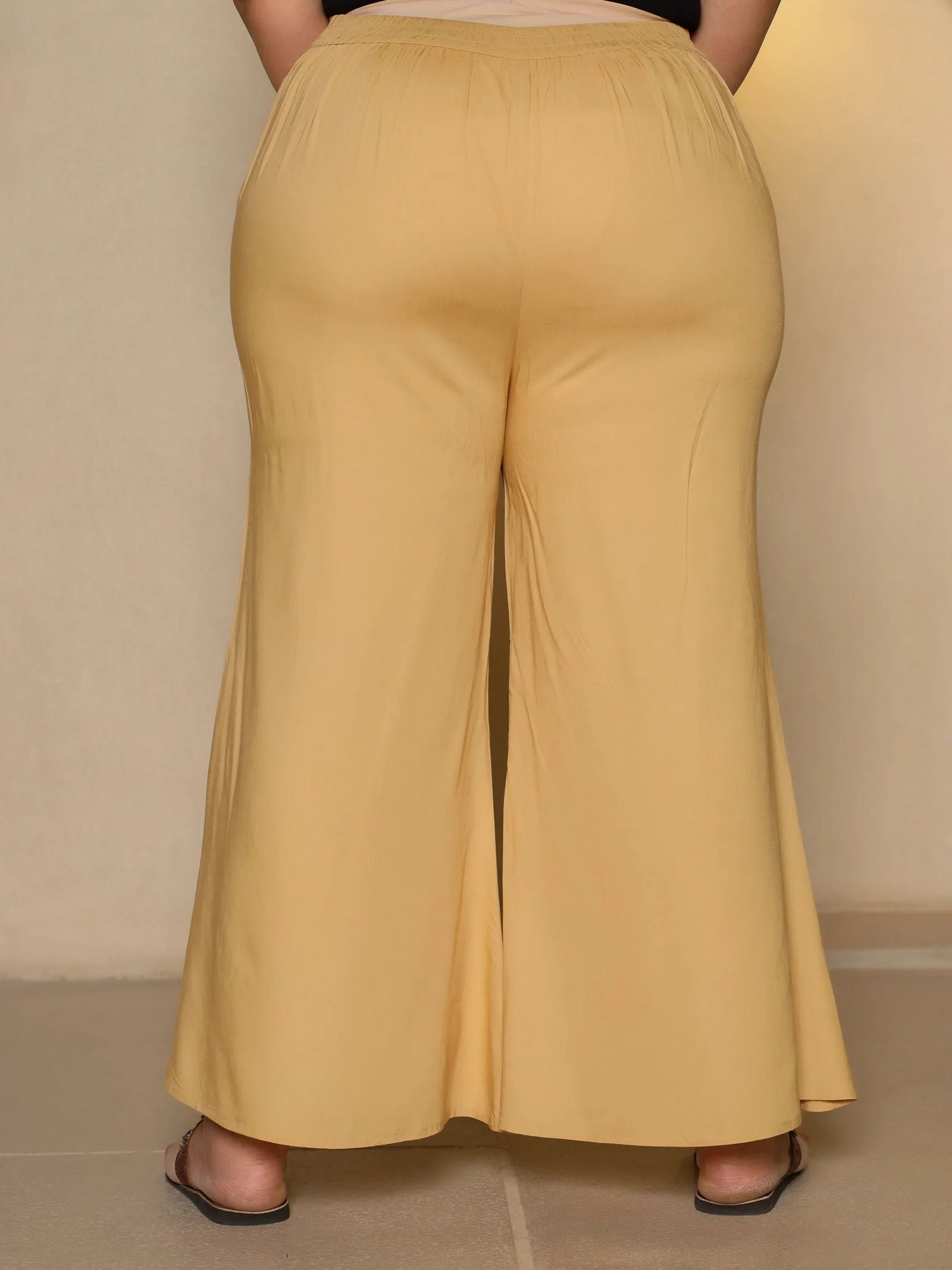 Jashvi Beige Modal Rayon Women Partially Elasticated Plus Size Bell Bottom Pants With Single Side Pocket